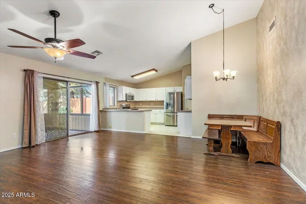 a view of a livingroom with furniture and wooden floor