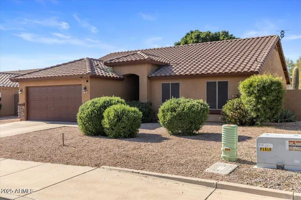 a front view of a house with a garage
