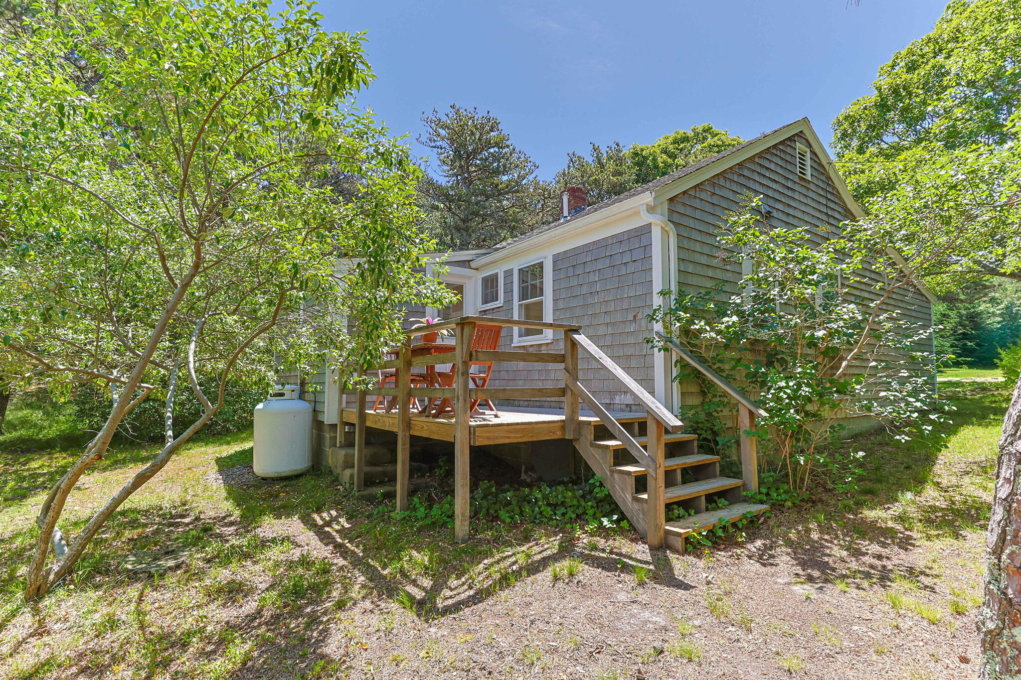 11 Whitmanville Road Truro, MA 02666 - Photo 23 of 31 a view of a house with backyard sitting area and garden