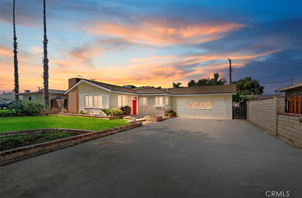 8797 Brunswick Avenue Riverside, CA 92503 - Photo 1 of 23 a view of a house with a yard and a street
