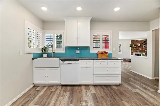a kitchen with wooden cabinets and a sink