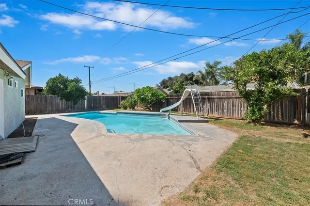 a view of a swimming pool with a patio