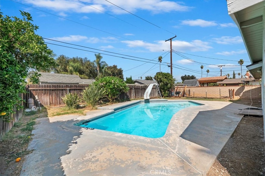 8797 Brunswick Avenue Riverside, CA 92503 - Photo 21 of 23 a view of a swimming pool with a patio