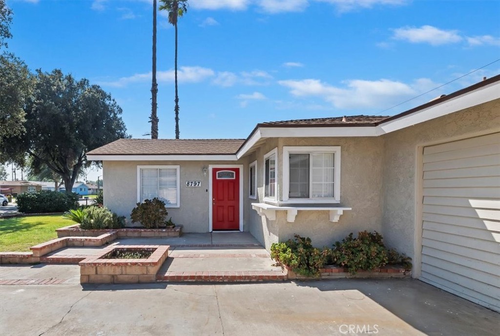 8797 Brunswick Avenue Riverside, CA 92503 - Photo 23 of 23 a front view of a house with a garden