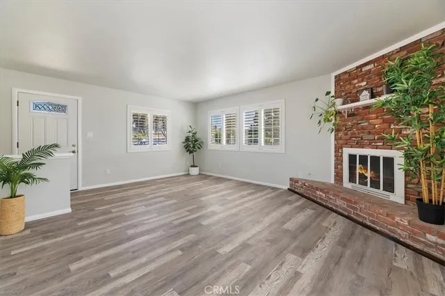 a view of a house with wooden floor and a window