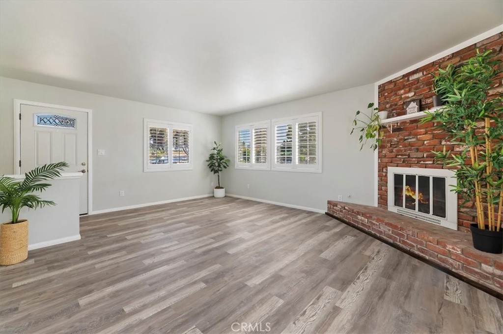 8797 Brunswick Avenue Riverside, CA 92503 - Photo 9 of 23 a view of a house with wooden floor and a window
