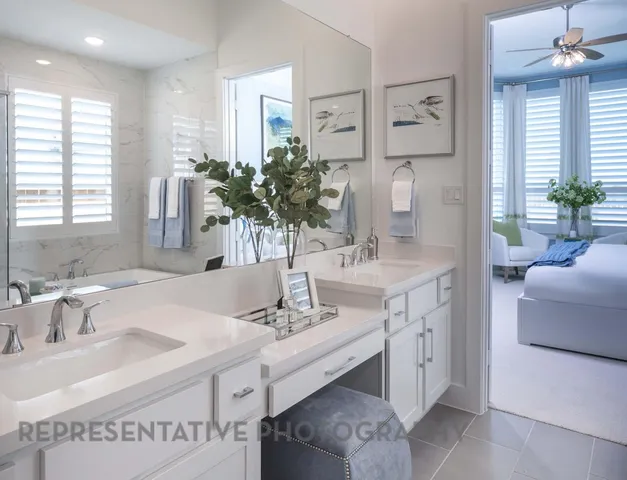 a bathroom with a sink double vanity and a mirror