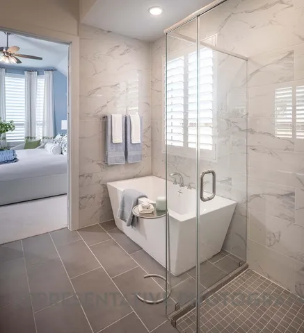 a bathroom with a bathtub and shower