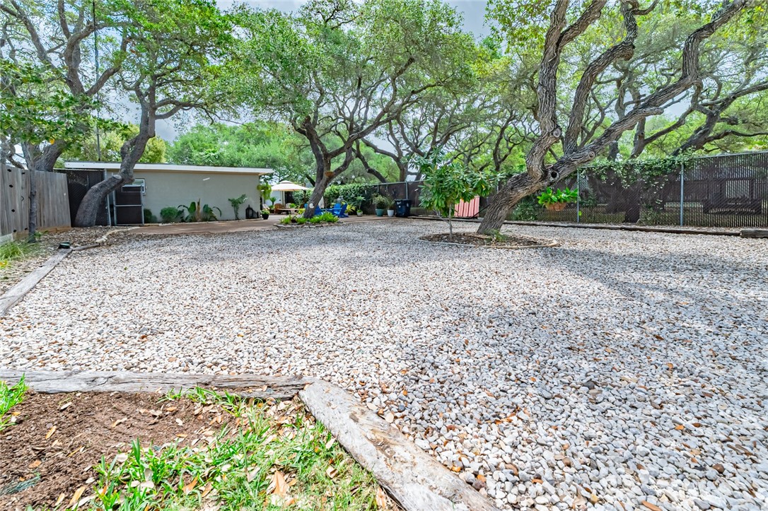 102 South 7th Street Fulton, TX 78358 - Photo 23 of 40 a view of a house with a yard and tree s