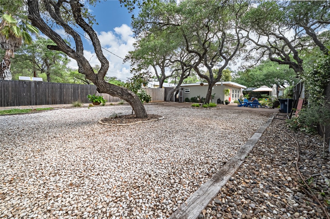 102 South 7th Street Fulton, TX 78358 - Photo 24 of 40 a backyard of a house with lots of green space