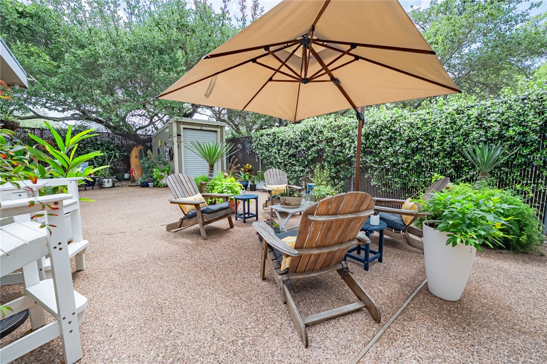 102 South 7th Street Fulton, TX 78358 - Photo 25 of 40 a view of a chair and table under an umbrella
