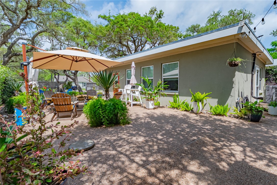 102 South 7th Street Fulton, TX 78358 - Photo 28 of 40 a view of a chair and table in the backyard of the house