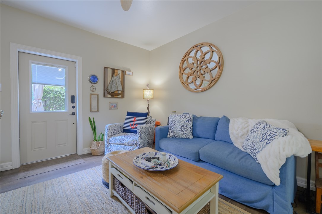 102 South 7th Street Fulton, TX 78358 - Photo 4 of 40 a living room with furniture and a wooden floor