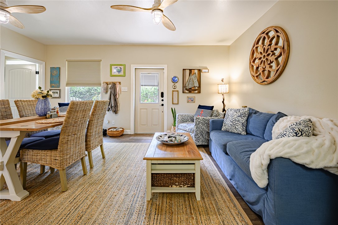 102 South 7th Street Fulton, TX 78358 - Photo 5 of 40 a living room with furniture and wooden floor