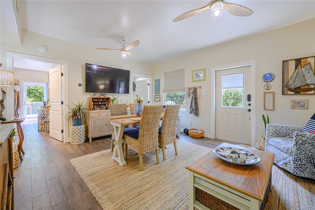 102 South 7th Street Fulton, TX 78358 - Photo 6 of 40 a living room with furniture and a flat screen tv
