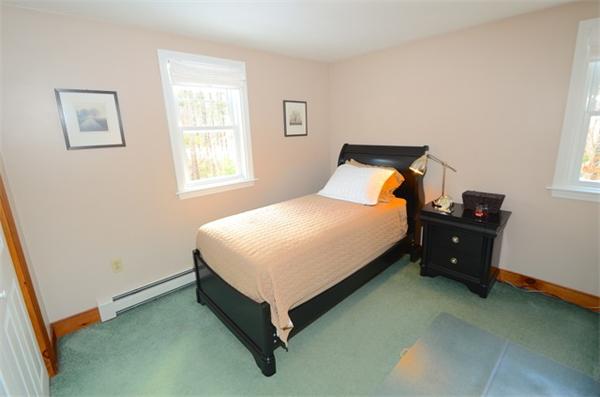 5 Old Farm Lane Rochester, MA 02770 - Photo 5 of 10 a bed sitting in a bedroom next to a window
