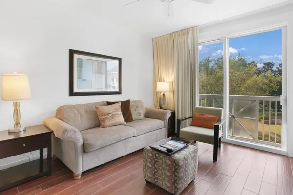 a living room with furniture and a lamp