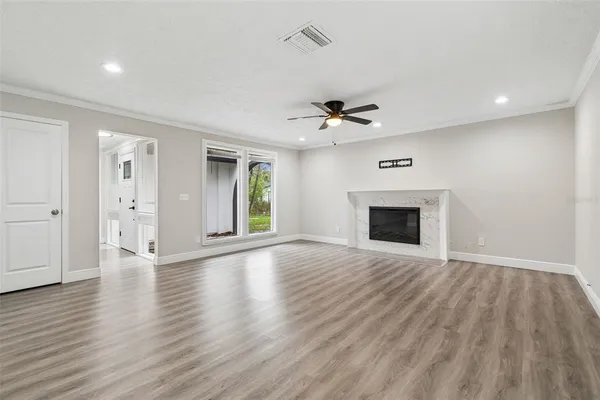 a view of kitchen with wooden floor and window
