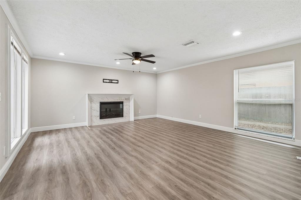 7403 Spring Court Tampa, FL 33634 - Photo 14 of 100 wooden floor in an empty room with a window