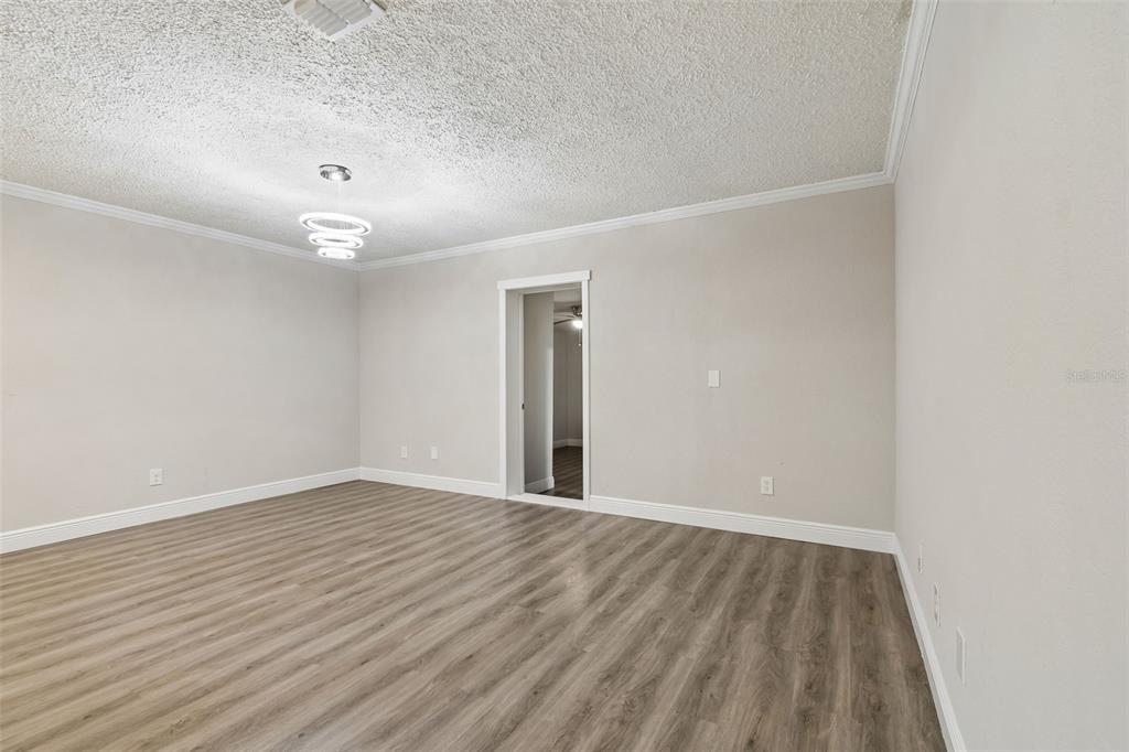 7403 Spring Court Tampa, FL 33634 - Photo 17 of 100 a view of an empty room with wooden floor