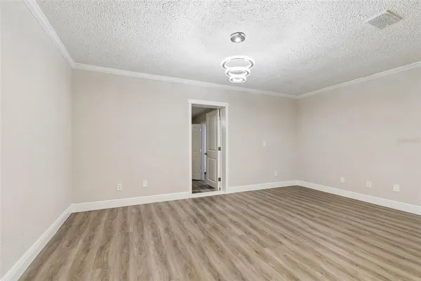 a kitchen with stainless steel appliances granite countertop a refrigerator and a stove