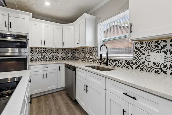 a living room with furniture and a ceiling fan