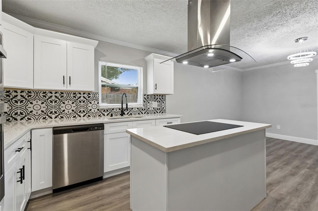 7403 Spring Court Tampa, FL 33634 - Photo 33 of 100 a kitchen with stainless steel appliances granite countertop a sink and a stove