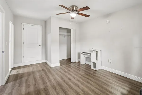 a bathroom with a shower sink and mirror