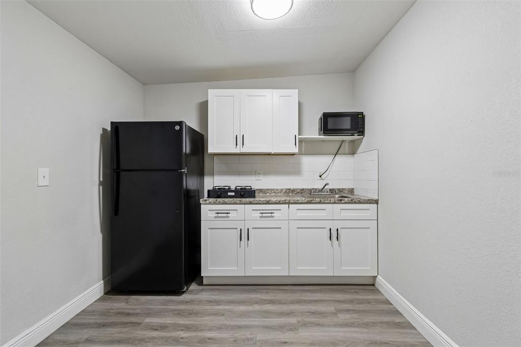 7403 Spring Court Tampa, FL 33634 - Photo 42 of 100 a kitchen with stainless steel appliances granite countertop a refrigerator and a stove