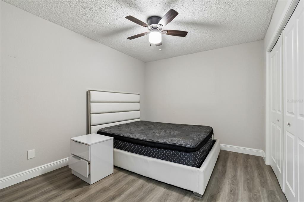 7403 Spring Court Tampa, FL 33634 - Photo 49 of 100 a living room with furniture and a ceiling fan