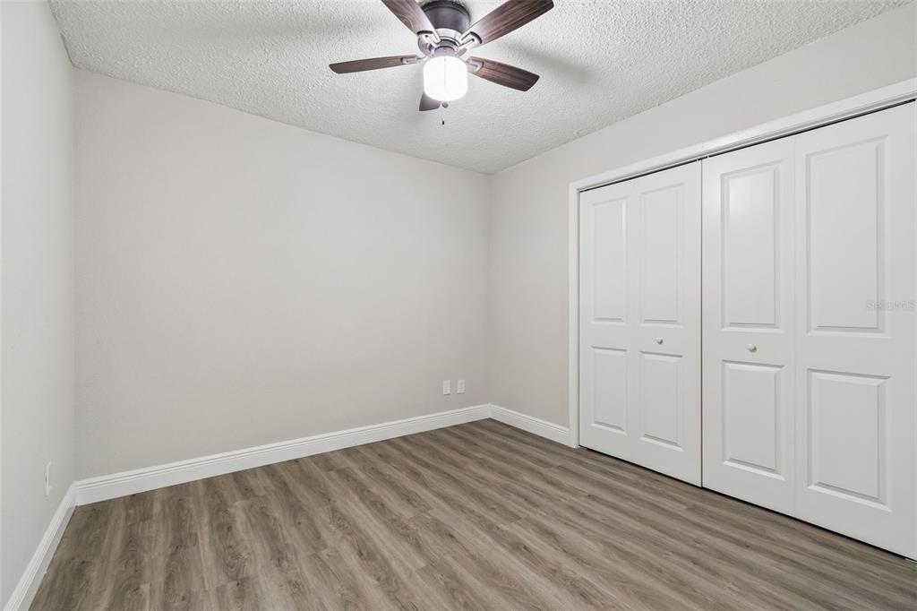 7403 Spring Court Tampa, FL 33634 - Photo 53 of 100 wooden floor in an empty room