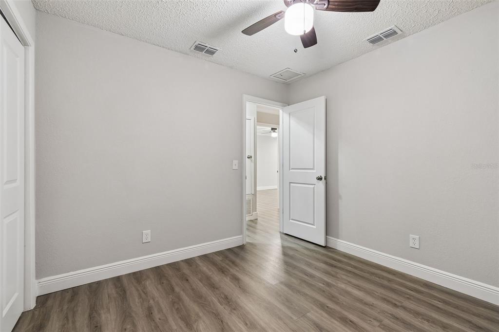 7403 Spring Court Tampa, FL 33634 - Photo 55 of 100 wooden floor in an empty room