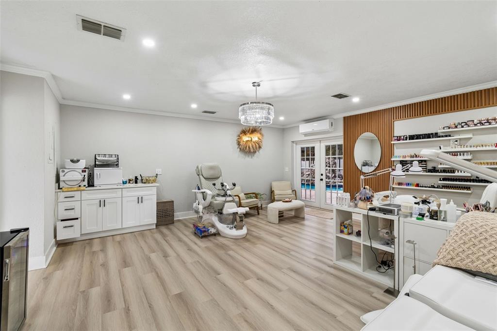 7403 Spring Court Tampa, FL 33634 - Photo 82 of 100 a large white kitchen with stainless steel appliances
