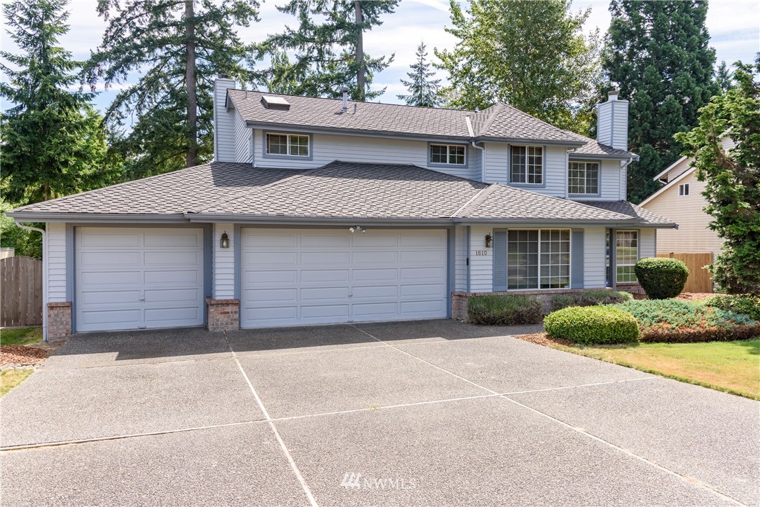 1610 Field Avenue Northeast Renton, WA 98059 - Photo 1 of 14 a front view of a house with a garden and garage