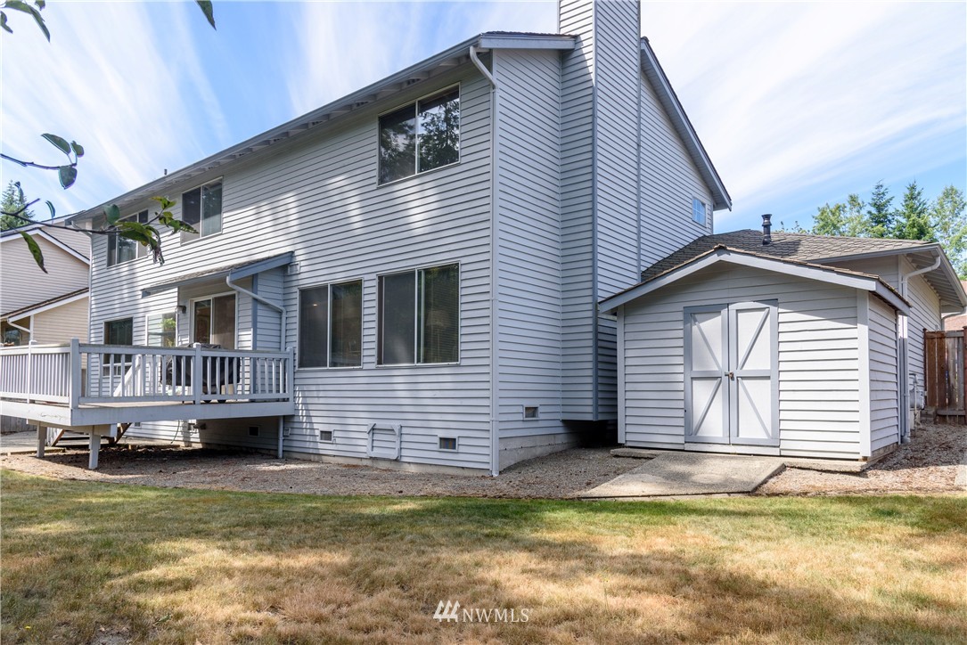1610 Field Avenue Northeast Renton, WA 98059 - Photo 14 of 14 a view of a house with a small deck and a large window