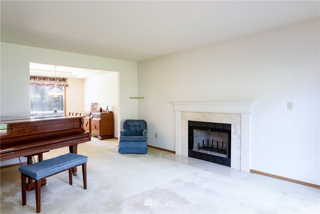 1610 Field Avenue Northeast Renton, WA 98059 - Photo 3 of 14 a living room with furniture and a fireplace