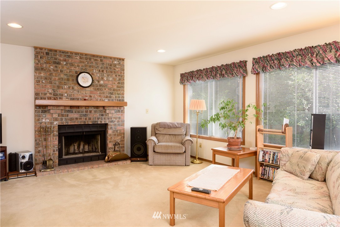 1610 Field Avenue Northeast Renton, WA 98059 - Photo 6 of 14 a living room with furniture and a fireplace