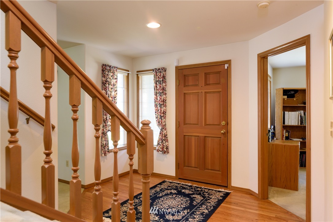 1610 Field Avenue Northeast Renton, WA 98059 - Photo 8 of 14 a view of an entryway with wooden floor and stairs