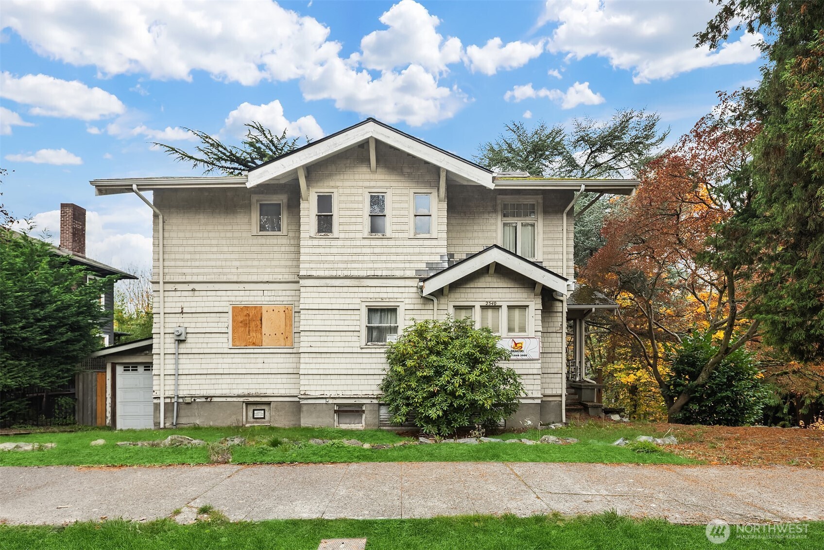 2540 34th Avenue South Seattle, WA 98144 - Photo 3 of 20 a view of a yard in front of a house with large windows