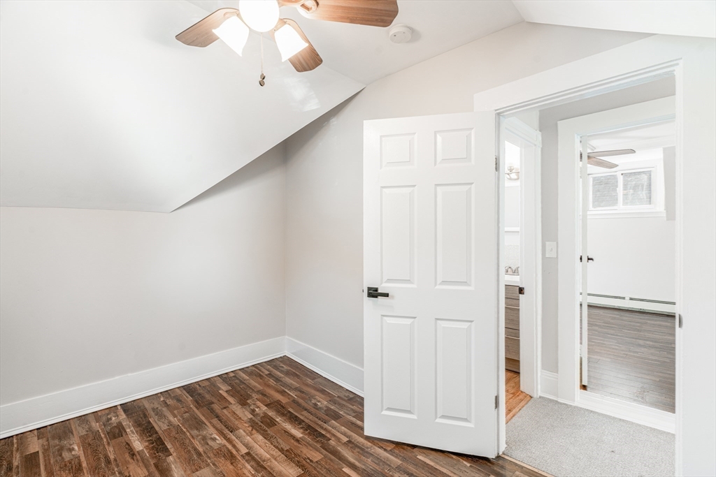 5 Sherbrook Place Lynn, MA 01904 - Photo 19 of 34 an empty room with wooden floor fan and windows