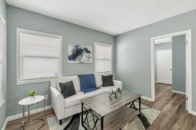a living room with furniture and a window
