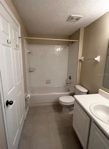 a bathroom with a toilet a sink and a bathtub