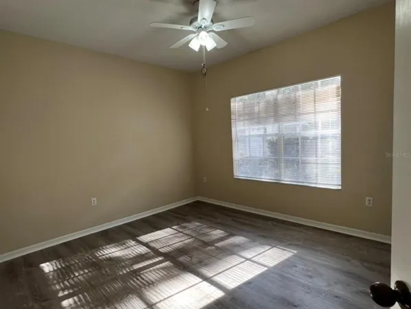 a view of workspace with window and ceiling fan