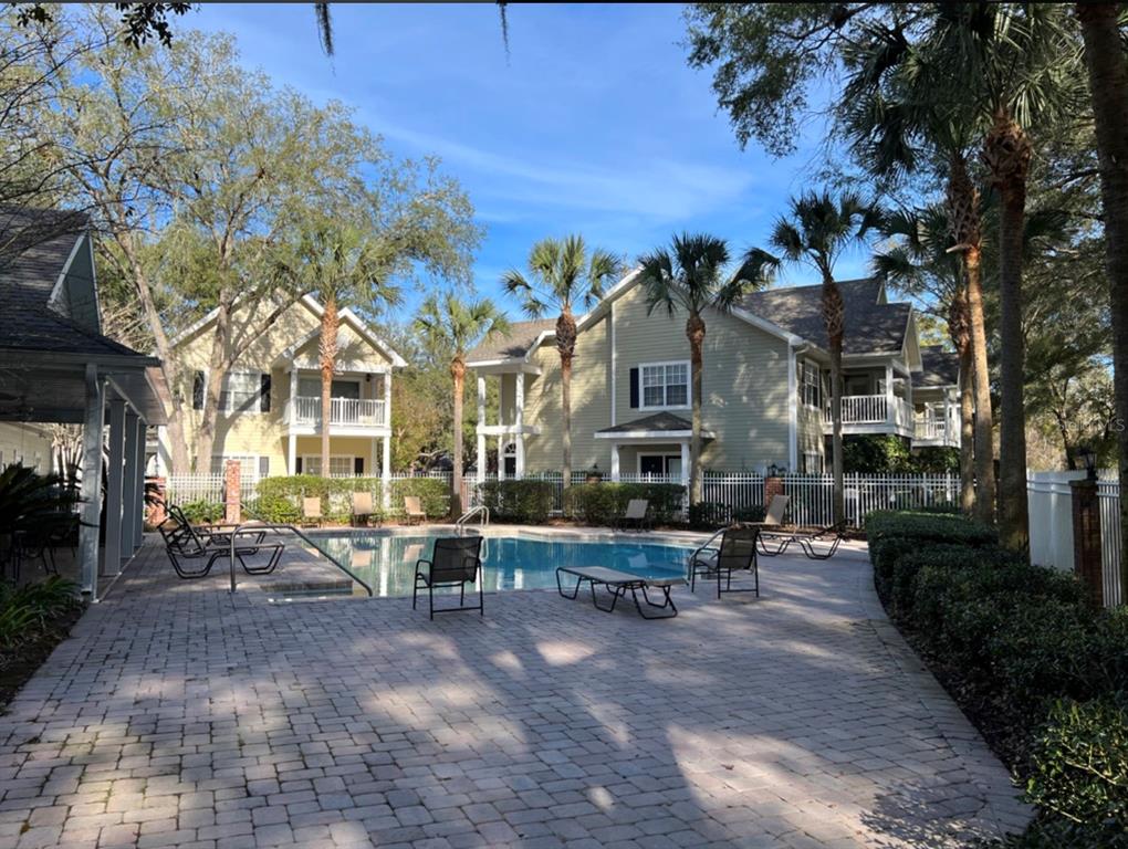 10000 Southwest 52nd Avenue, Unit U131 Gainesville, FL 32608 - Photo 2 of 15 a view of a building with sitting area