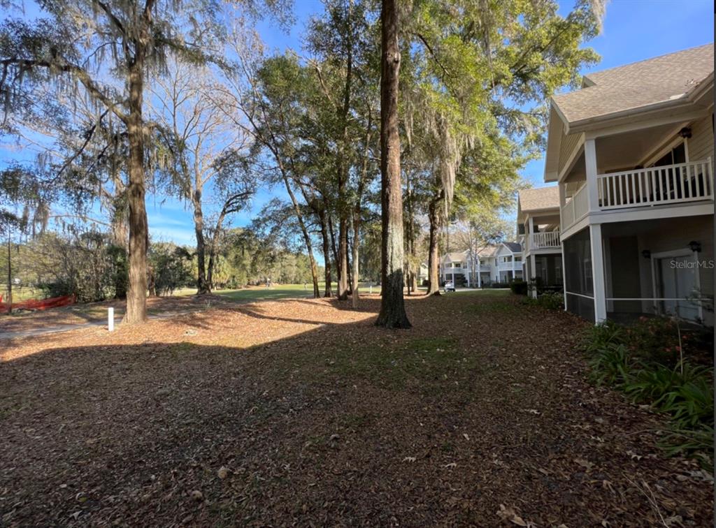 10000 Southwest 52nd Avenue, Unit U131 Gainesville, FL 32608 - Photo 8 of 15 a view of street with large trees