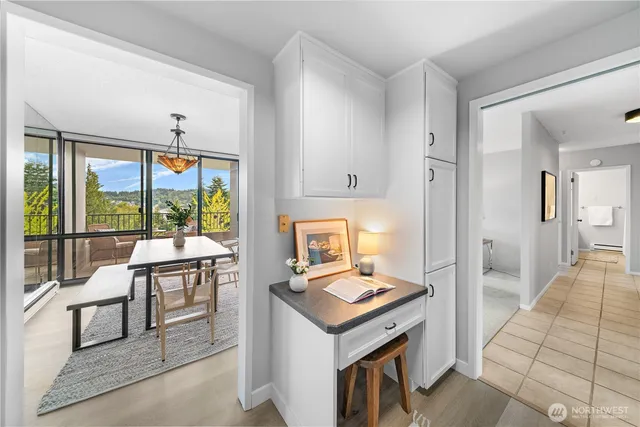 a bedroom with furniture and a large window