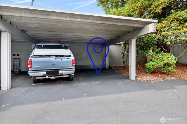 a living room with furniture and a book shelf