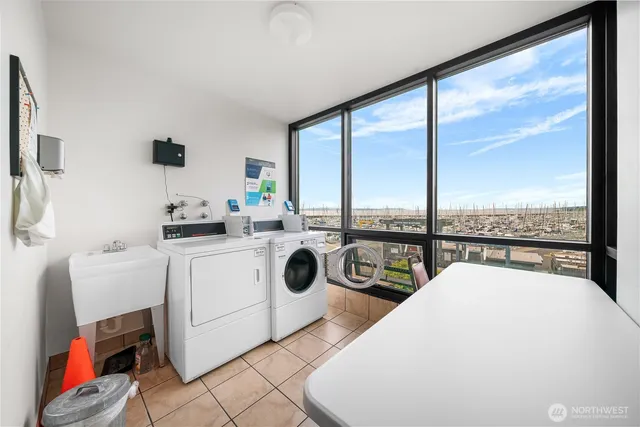 a view of swimming pool with outdoor seating and city view