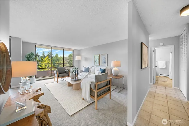 a living room with furniture and a large window