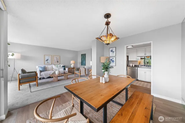 a view of a dining room with furniture and wooden floor